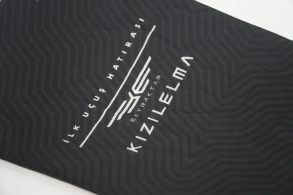Print quality detail on black branded buff by Textile Promos
