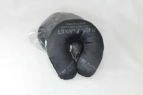 Black travel neck pillow with custom branding in transparent packaging – Textile Promos