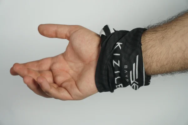 Branded promotional buff worn as a wristband – usage example by Textile Promos