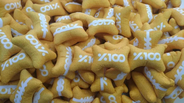 Bulk production of yellow bone-shaped neck pillows with %100 logo – Textile Promos