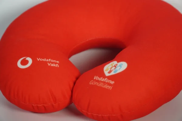 Side view detail of red printed travel neck pillow with custom logo – Textile Promos