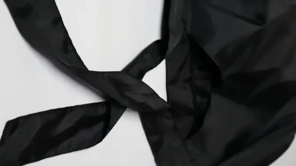 Satin bonnet black detail photo showing smooth fabric and secure stitching