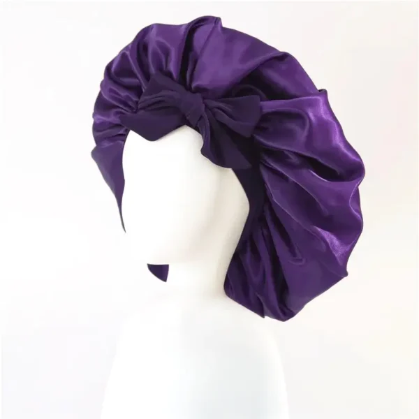 Purple satin bonnet night cap with bow detail on mannequin – Textile Promos