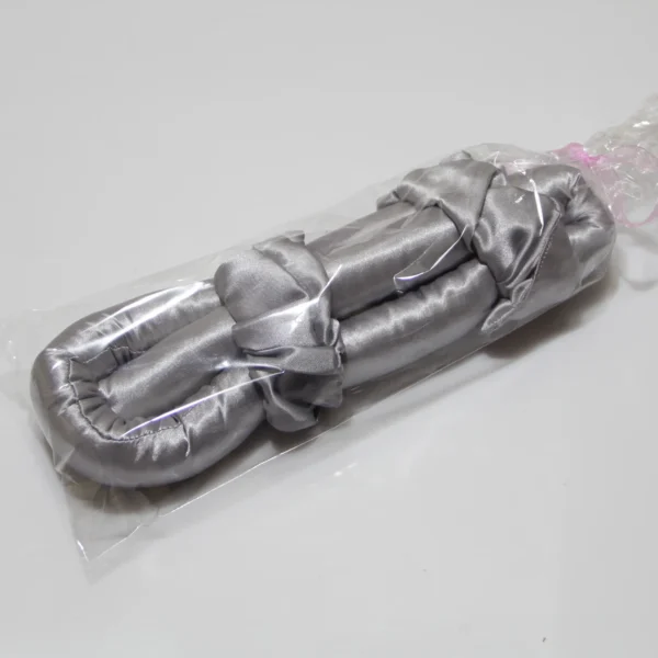 Silver satin heatless curling rod packaged in clear plastic wrap