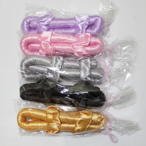 Packaged satin heatless curling rods in purple, pink, silver, black, and gold