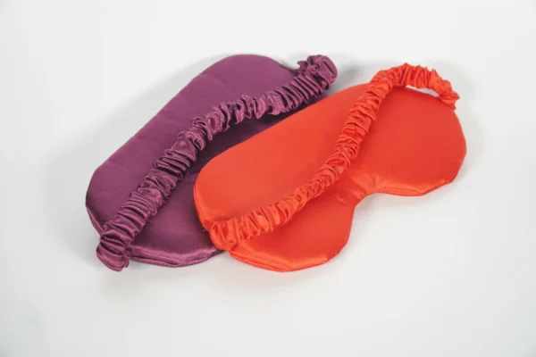 Back view of two satin sleep masks showing elastic bands – Textile Promos