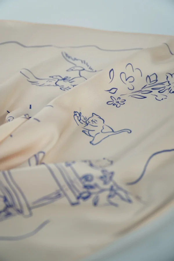 Extreme close-up of square scarf showing fabric texture and custom print – Textile Promos