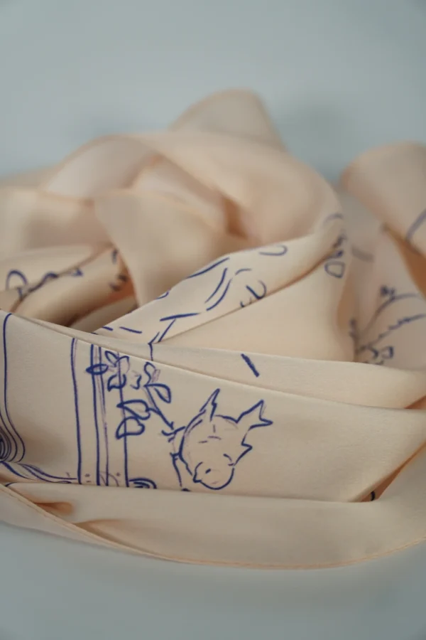 Side view of rolled square scarf with visible print – Textile Promos