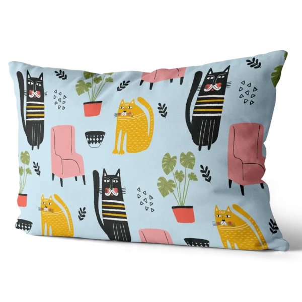 Toddler pillow with light blue background and playful black and yellow cat illustrations alongside pink chairs and green plants