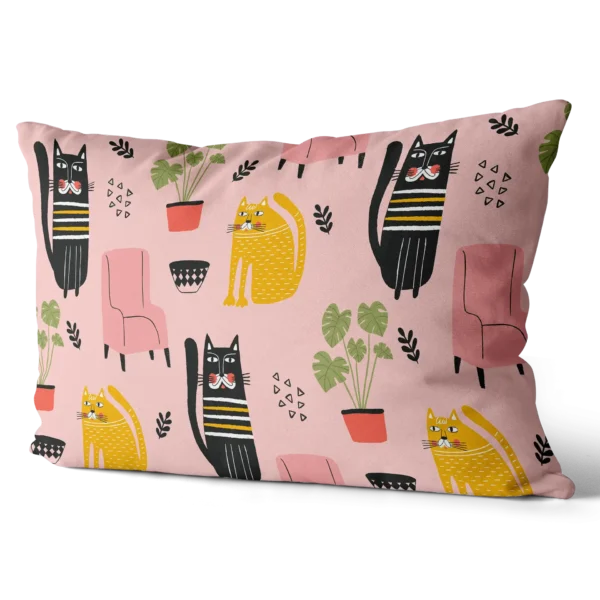Toddler pillow with pink background featuring cute black and yellow cat illustrations and home decor elements