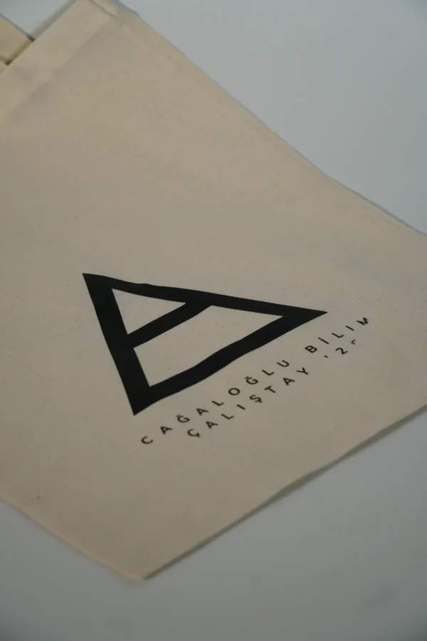 Close-up of custom logo print on natural cotton tote bag – Textile Promos