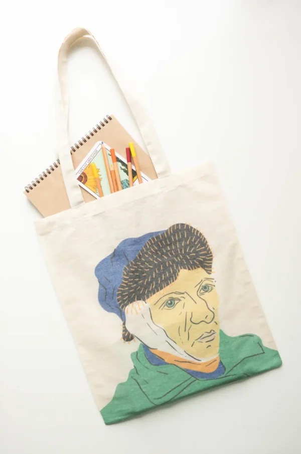 Van Gogh canvas tote bag with art supplies and sketchbook inside