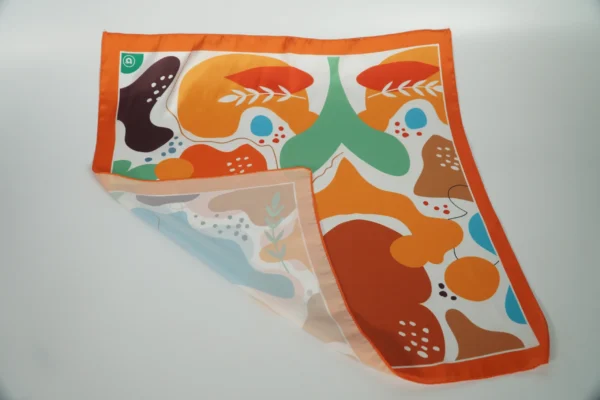 Close-up of smooth sewing on vivid patterned square scarf – Textile Promos